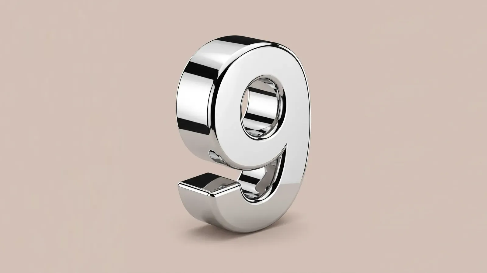 A polished chrome numeral nine standing upright against a plain dusty pink background.